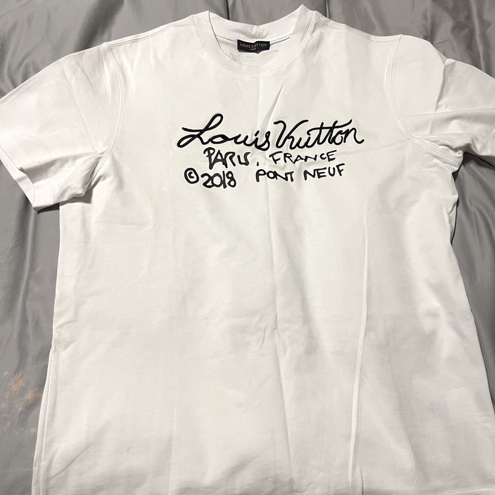 White LV shirt size large good condition  .